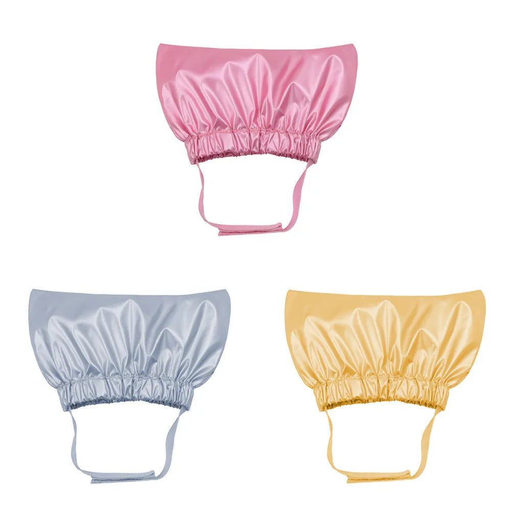 Silver pink and gold adjustable waterproof shower cap for pet ear protection during baths.