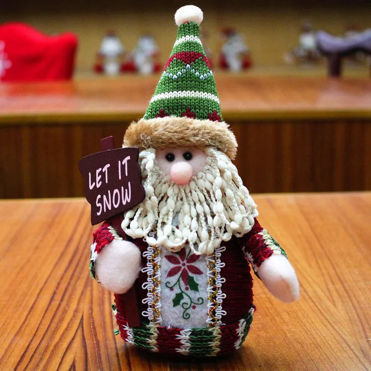 Red, green and white flannel Christmas snowman wall decoration measuring 18x13 cm.