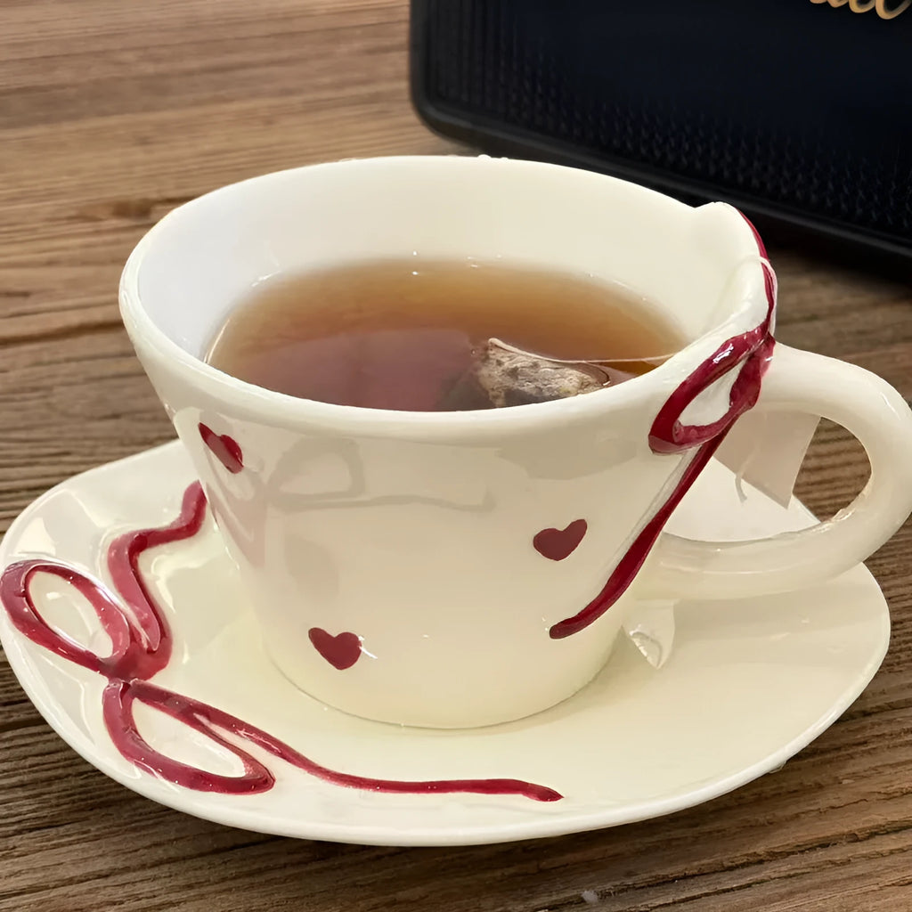 Hand painted white porcelain coffee cup with cherry design and matching coaster
