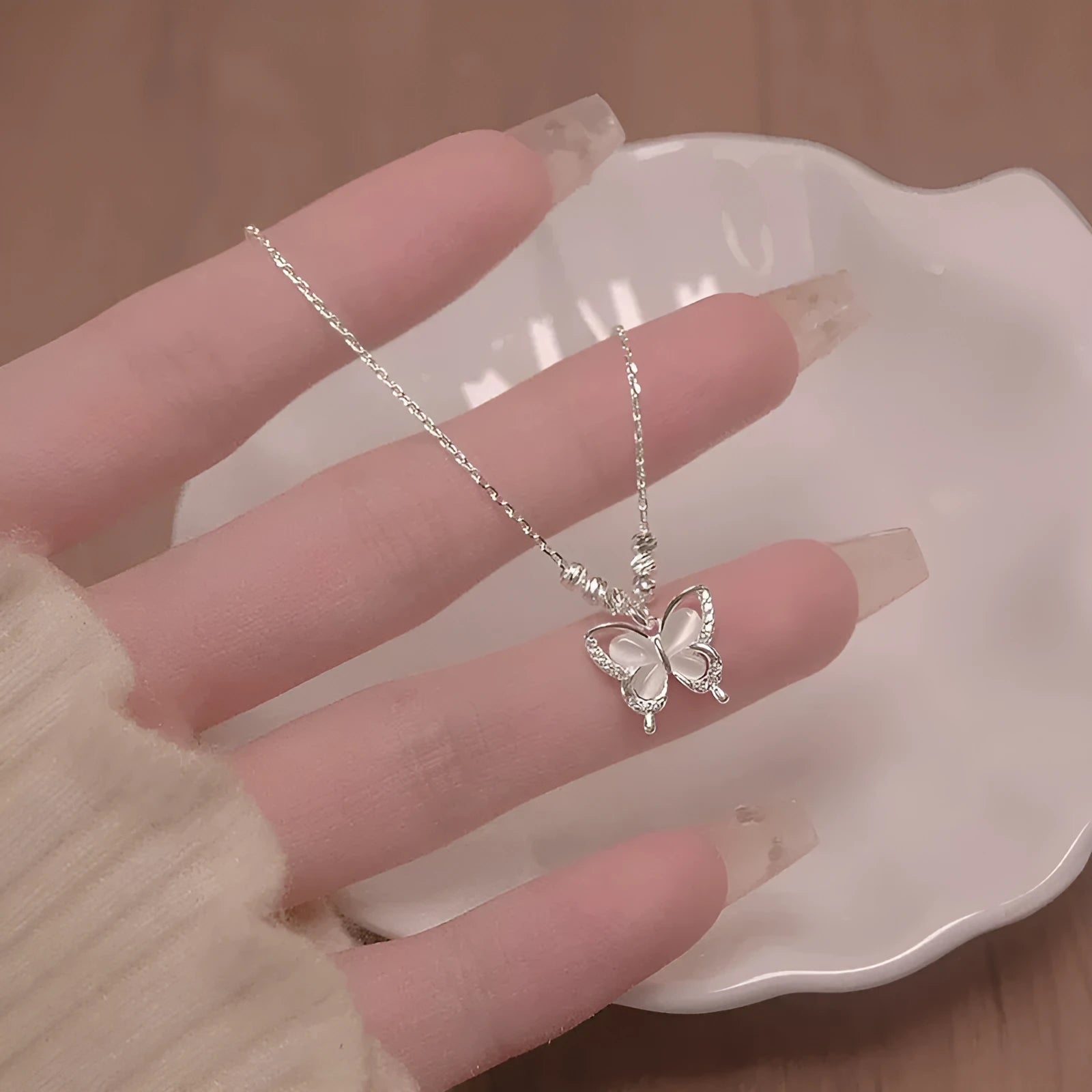 Women's square line opal butterfly necklace on a silver cross chain, adjustable from 41cm to 50cm.