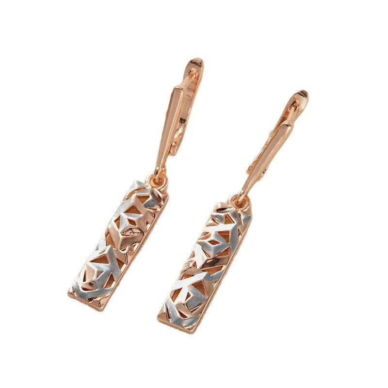A pair of rectangular two-tone hollow stud earrings with a geometric design and picture-style colour finish.