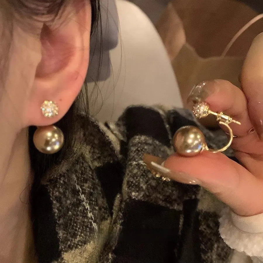 Geometric pearl stud earrings in gold electroplated copper with hanging-back design for women