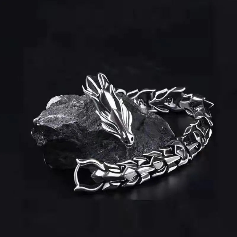 Men's silver geometric keel shape alloy bracelet on a neutral background showing minimal design