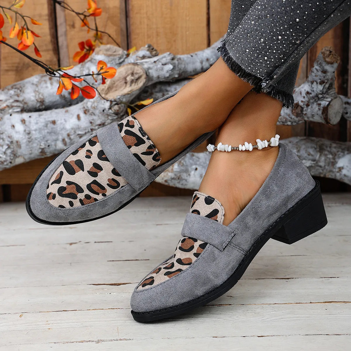 Leopard print suede slip-on pumps with a chunky heel and pointed toe in pink, brown, and khaki.