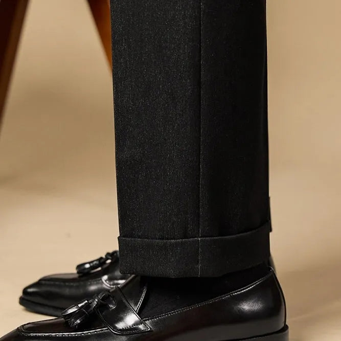 Black and brown business casual loafers with tassel detail and genuine leather upper