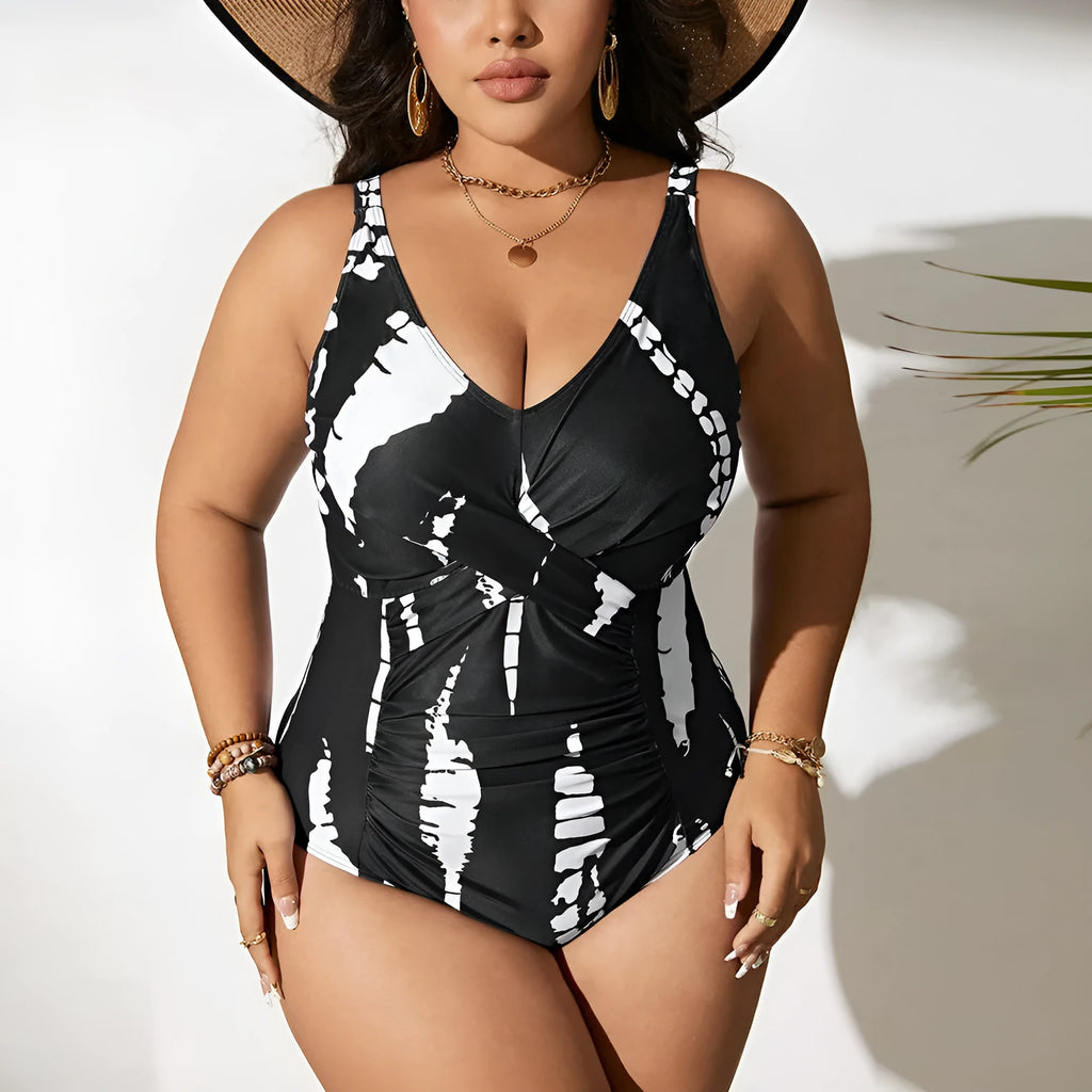 Black Siamese colour matching fit one-piece swimsuit on a hanger.