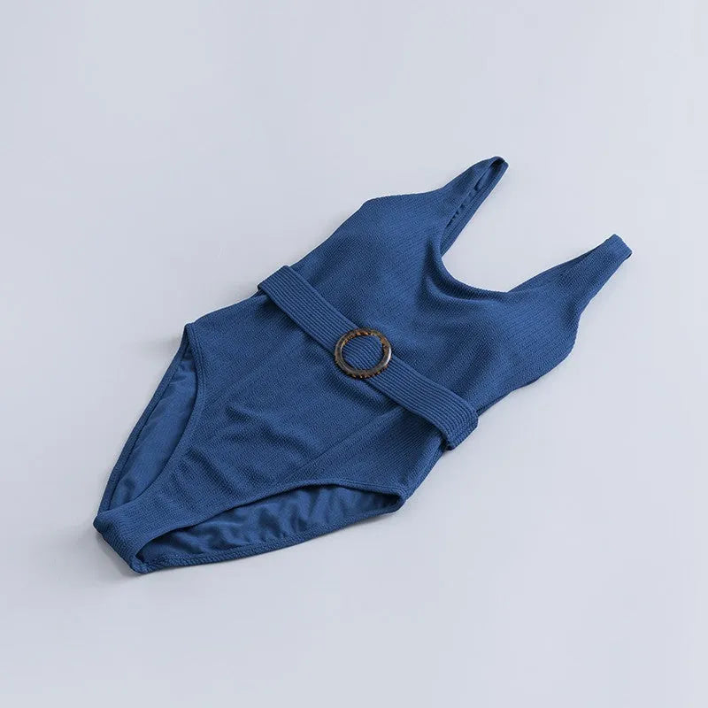 Navy blue women's one-piece swimsuit with triangular chest shape and integrated chest pads