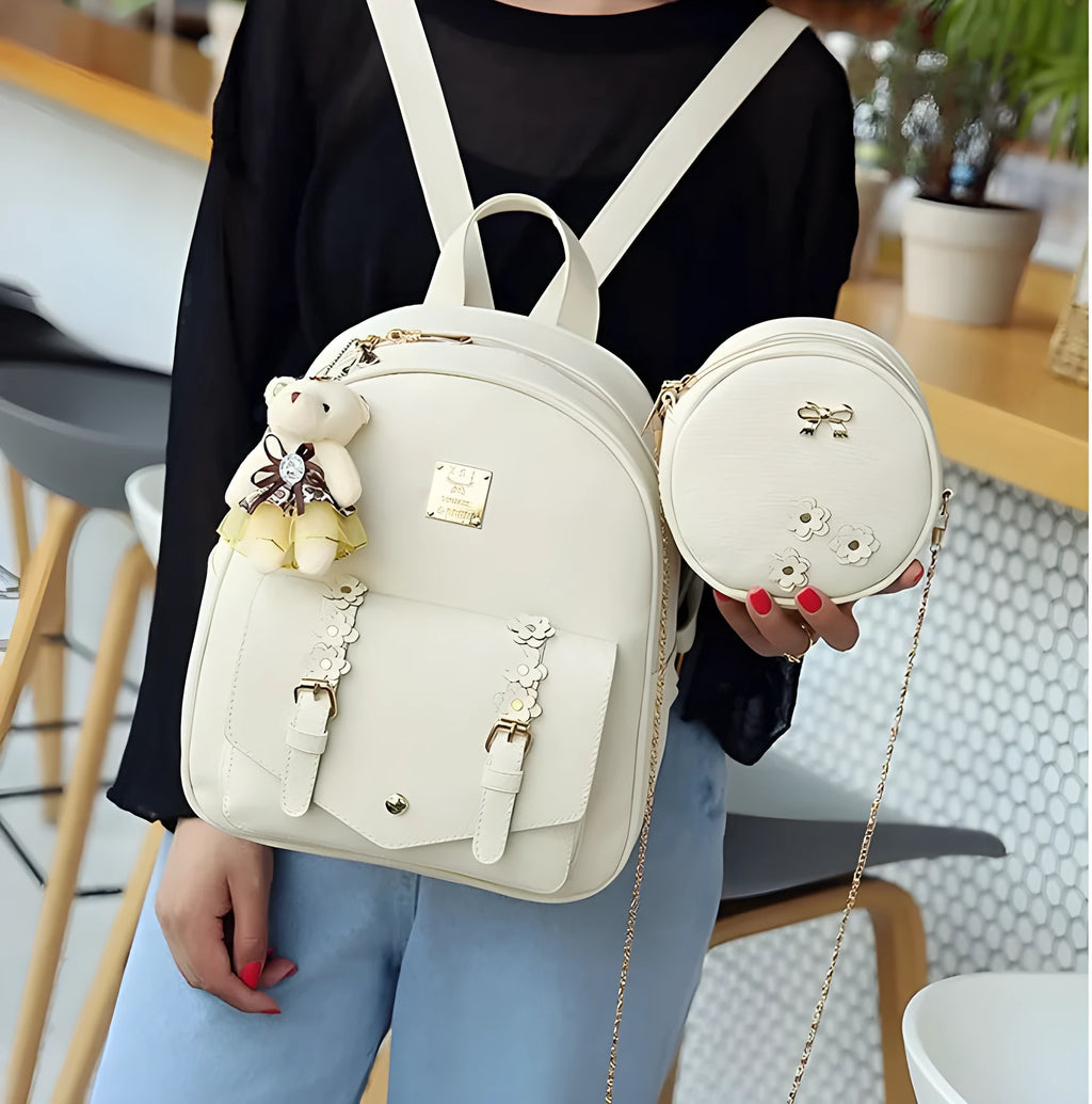Women's three-piece PU leather bag set showing backpack, shoulder bag and card purse in matching colour.