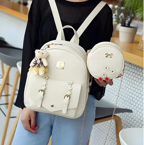 Women's 3-piece floral print PU leather bag set showing backpack, shoulder bag, and card purse in pink.