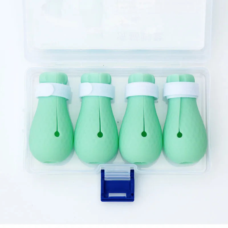 Green silicone cat anti-scratch foot covers with adjustable straps for pet handling