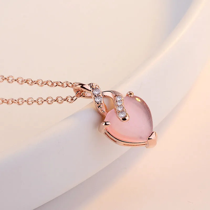 Women's pink heart crystal necklace with rose gold cross chain pendant