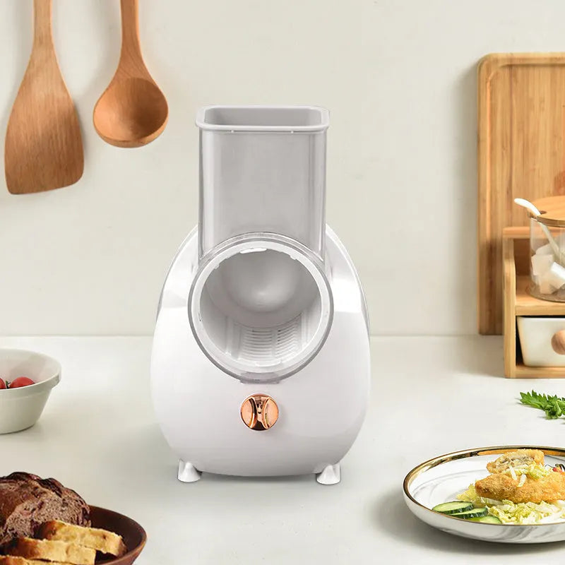 White electric vegetable slicer with rotary grater, strong suction base, and multiple blade attachments