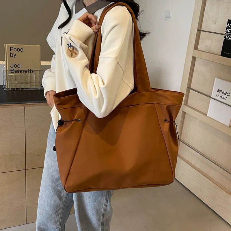 Soft foldable Oxford cloth commuter shoulder tote bag shown in light grey colour.