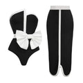 Women's black and white colour-block one-piece swimsuit with irregular tube top and bow detail