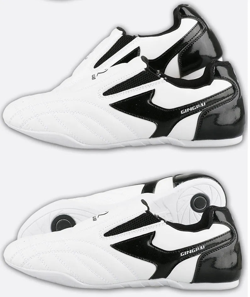 Black and white children's martial arts training shoes with a soft bottom and widened fit for Sanda and Taekwondo.