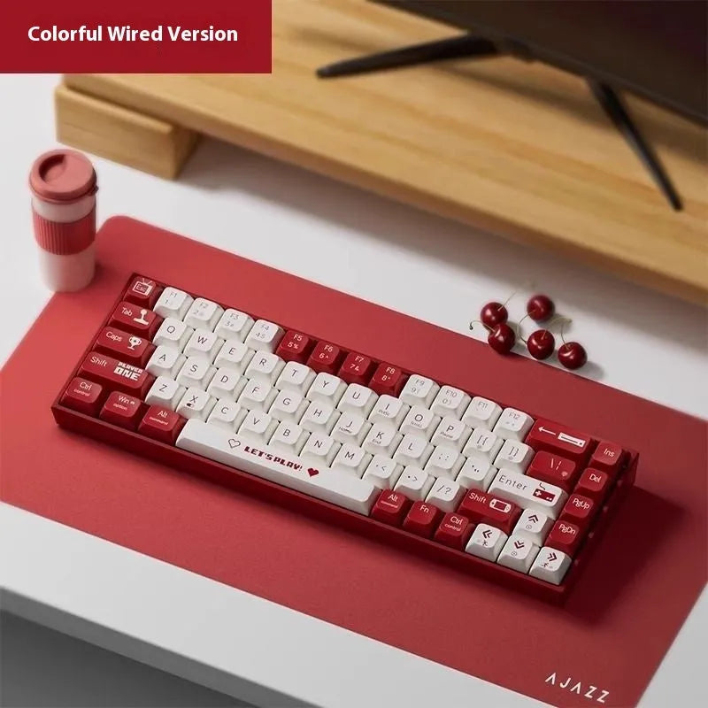 AJAZZ AK680 wired mechanical gaming keyboard in red and white colour scheme on a desktop.