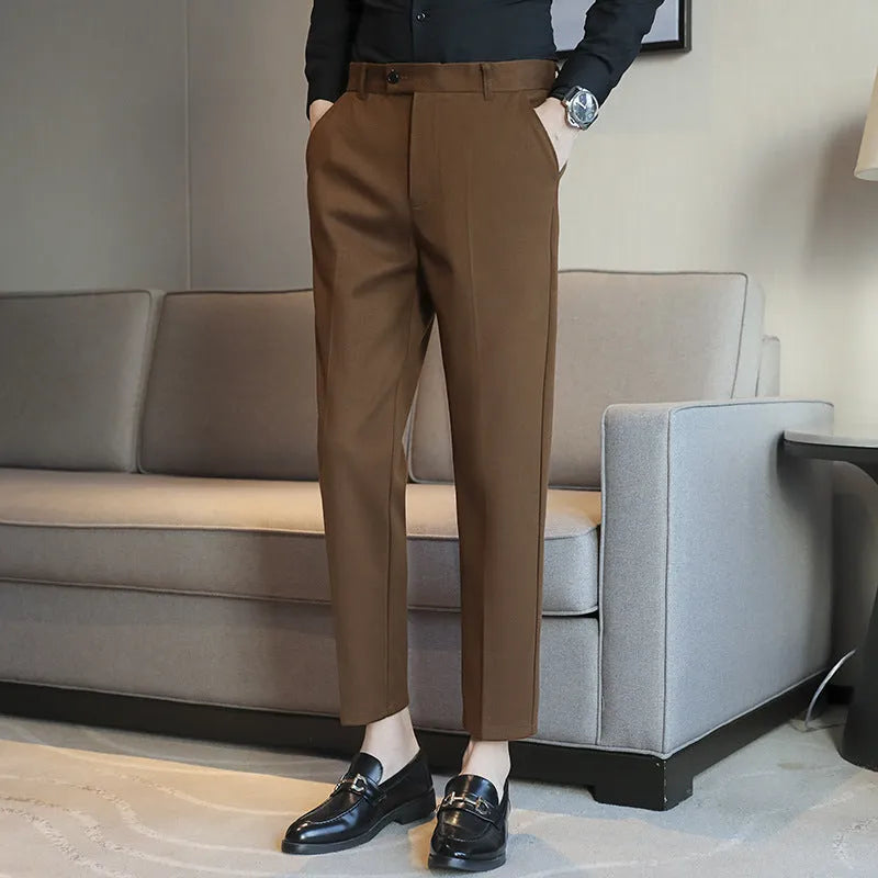 Straight retro brown corduroy trousers with elastic waistband on hanger