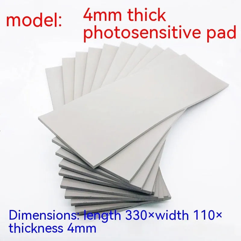 Black and grey plastic photosensitive mat for seal making, shown with dimensions 330mm by 110mm.