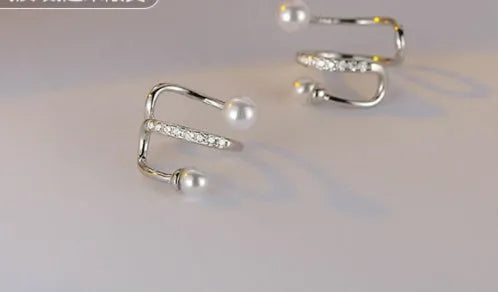 Silver plated pearl ear clips for unpierced ears, shown as a gold or silver pair in Japanese Korean style.