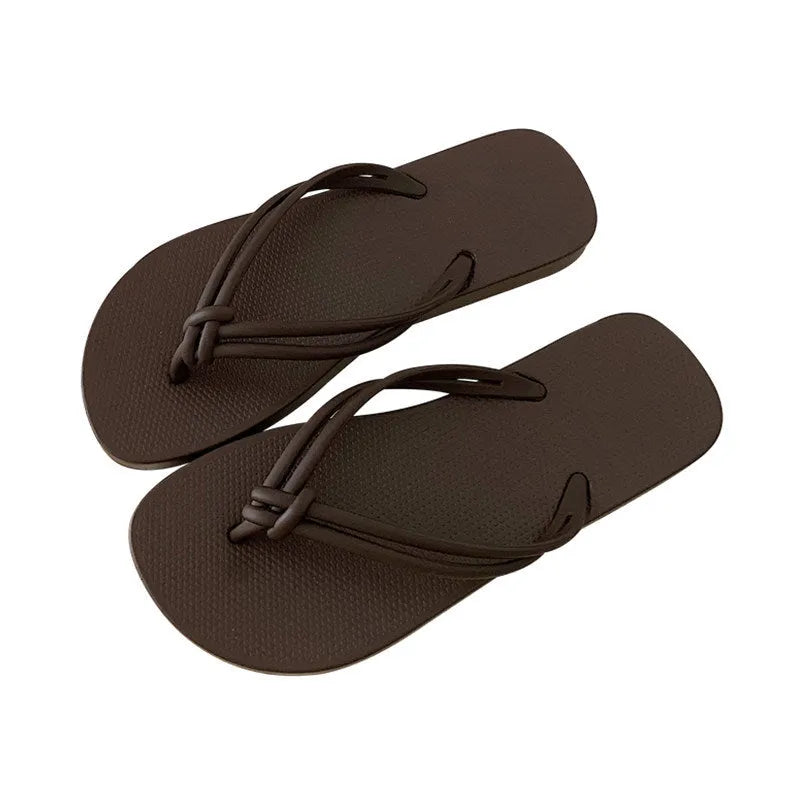 PVC toe-covering flip flops for men on a plain background showing colours and injection-moulded sole.