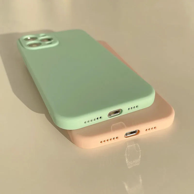 Frosted silicone phone case for iPhone 14 in slate blue colour showing matte texture and precise cutouts.