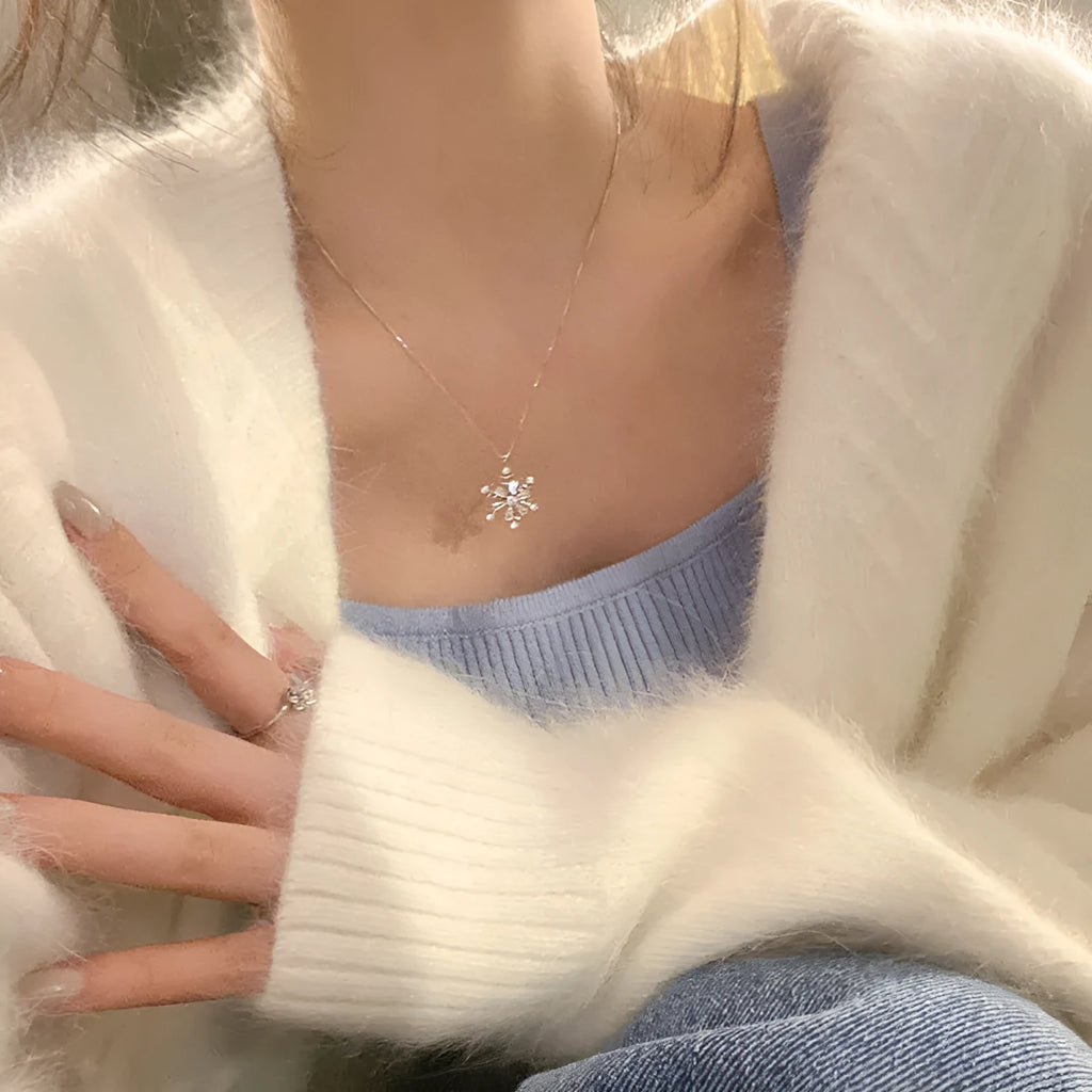 Silver snowflake pendant necklace on woman, copper base with electroplated finish, 45 cm chain