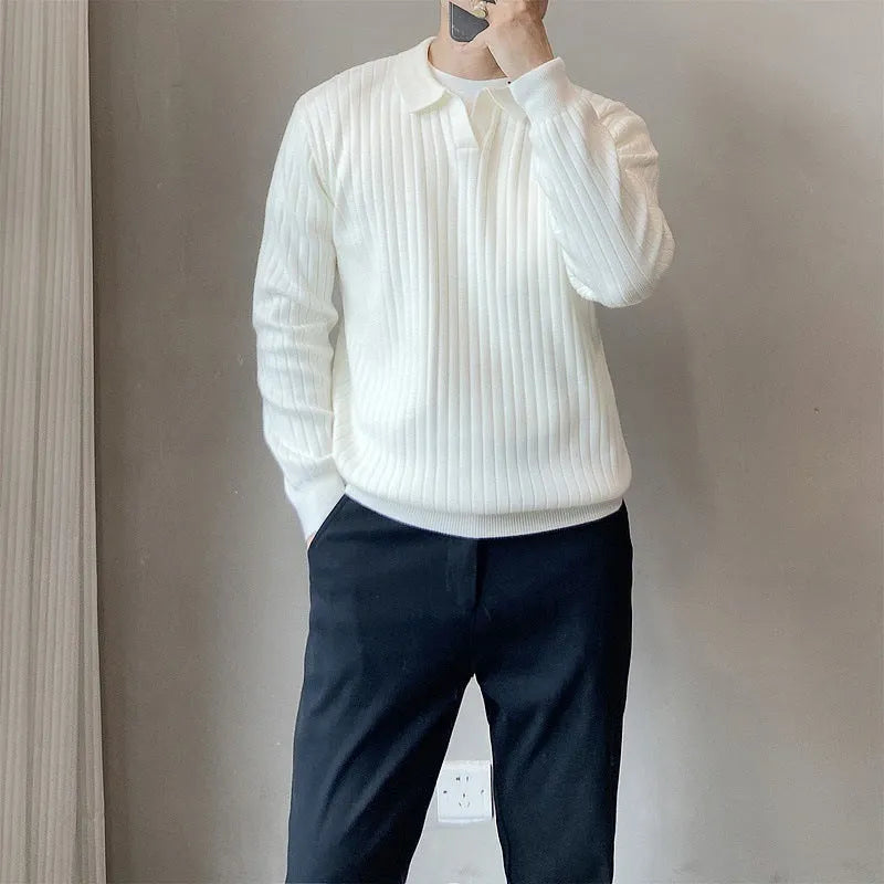 Men's loose grey knitted pullover sweater with long sleeves on a hanger.