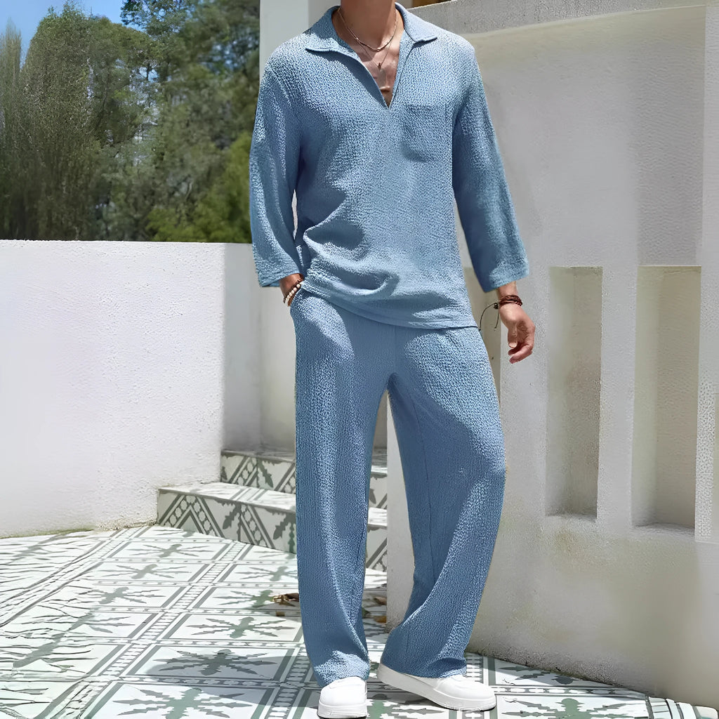 Man wearing a lake blue casual shirt and trouser suit set for commuting.
