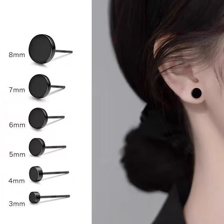 A pair of flat, round sterling silver S999 bone stud earrings on a plain background, showing silver and black colour options.