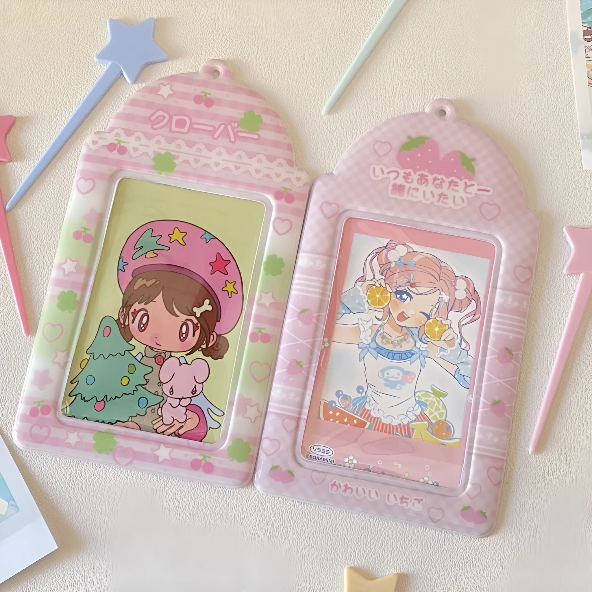 Cartoon PVC meal card holder pendant on a chain, showing strawberry and four-leaf clover design options.