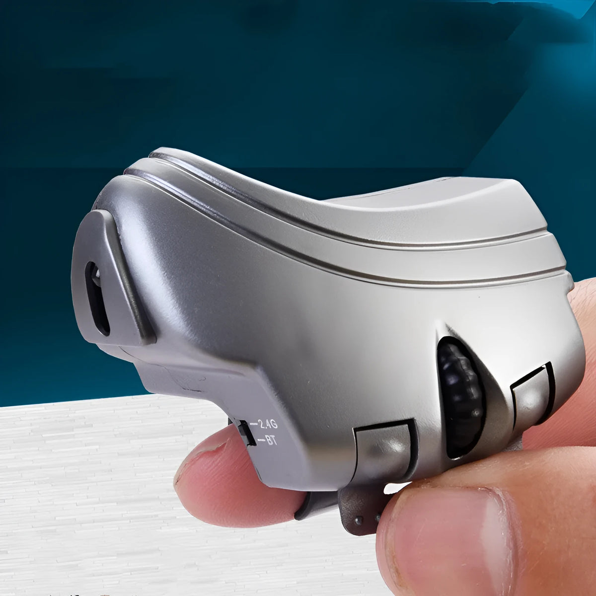 Black and silver grey finger ring mouse, 2.4GHz wireless, 1000dpi optical, 60mm by 40mm, rechargeable, three keys