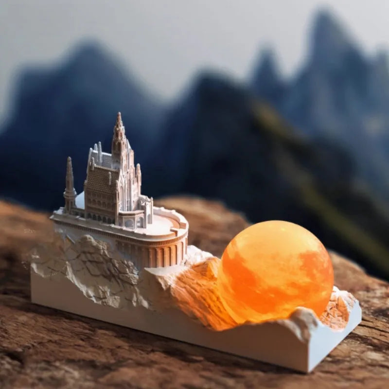 Small mountain-shaped LED night light with touch control, shown as part of a gift box set with essential oil and card for bedroom or desktop decoration.