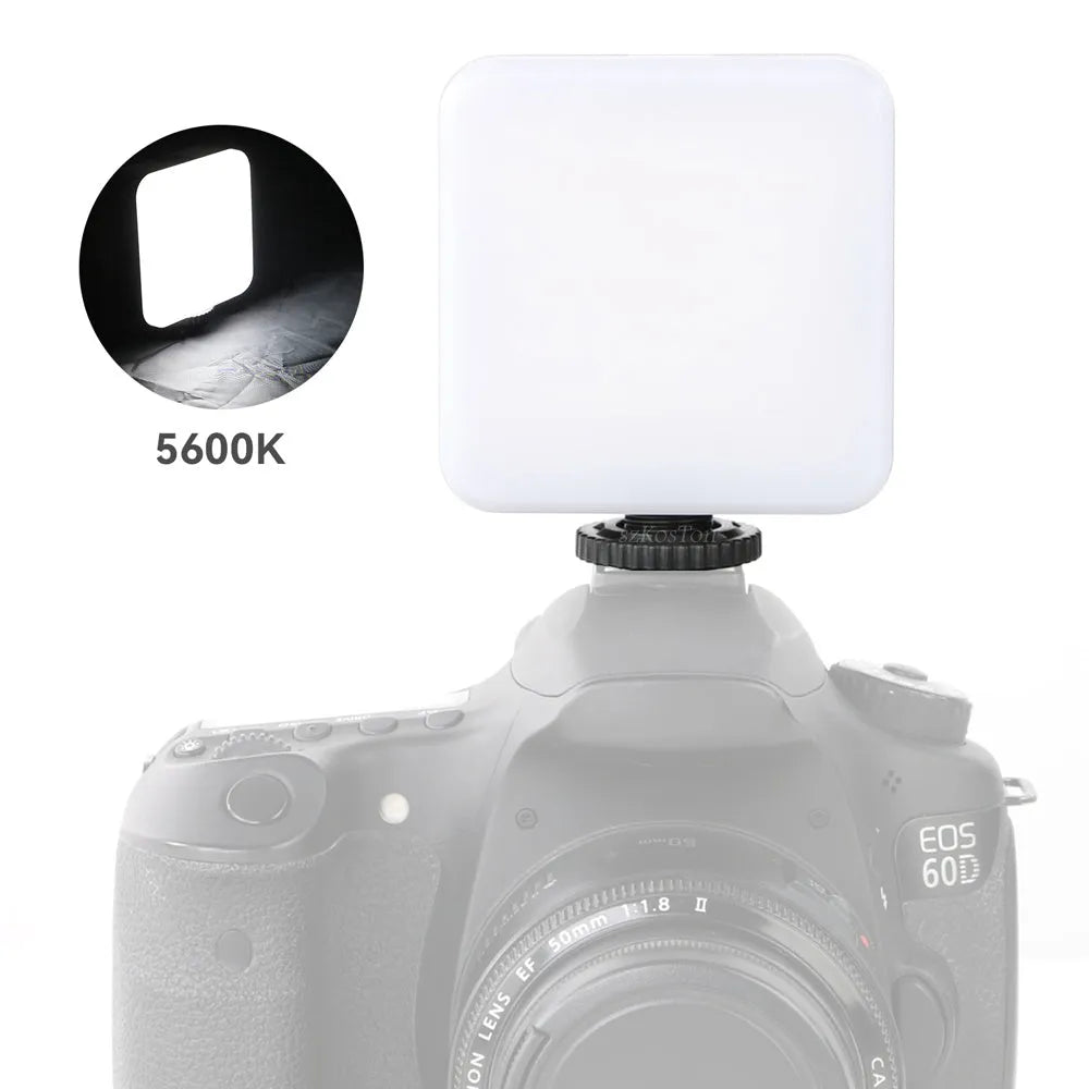 Small square universal camera flash unit with hot shoe mount and rotatable head.