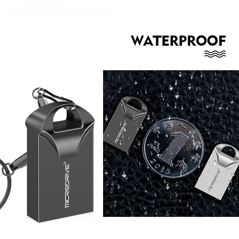 Small black and silver metal USB flash drive showing miniature size