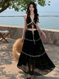 Three-piece bikini swimsuit set with halterneck top, long skirt, and shorts in pink or black, sizes S to XL
