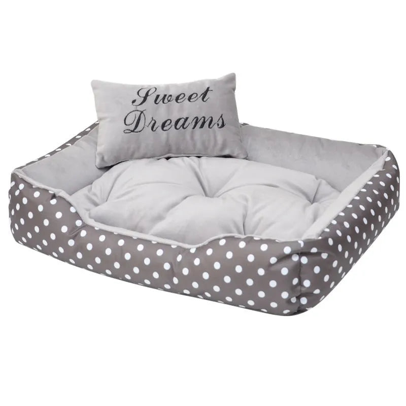 Polka dot printed small dog bed with matching square pillow in grey, blue, pink, or red.