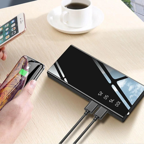 Black 20000mAh power bank with LCD display showing battery level and two USB ports
