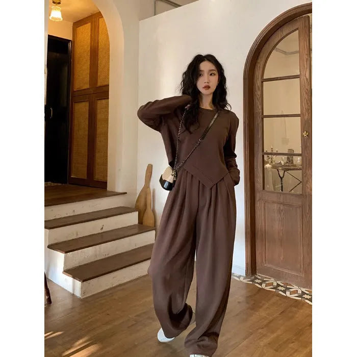 Women's khaki casual sports suit set with long sleeve top and trousers on a hanger