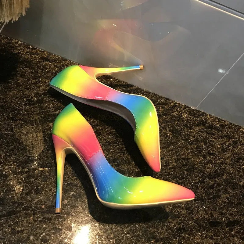 Rainbow multicolour patent leather women's high heel shoe with thin heel and pointed toe.