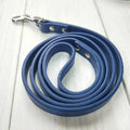 Genuine leather dog leash and collar set in black, 120cm lead, size M, on a wooden floor