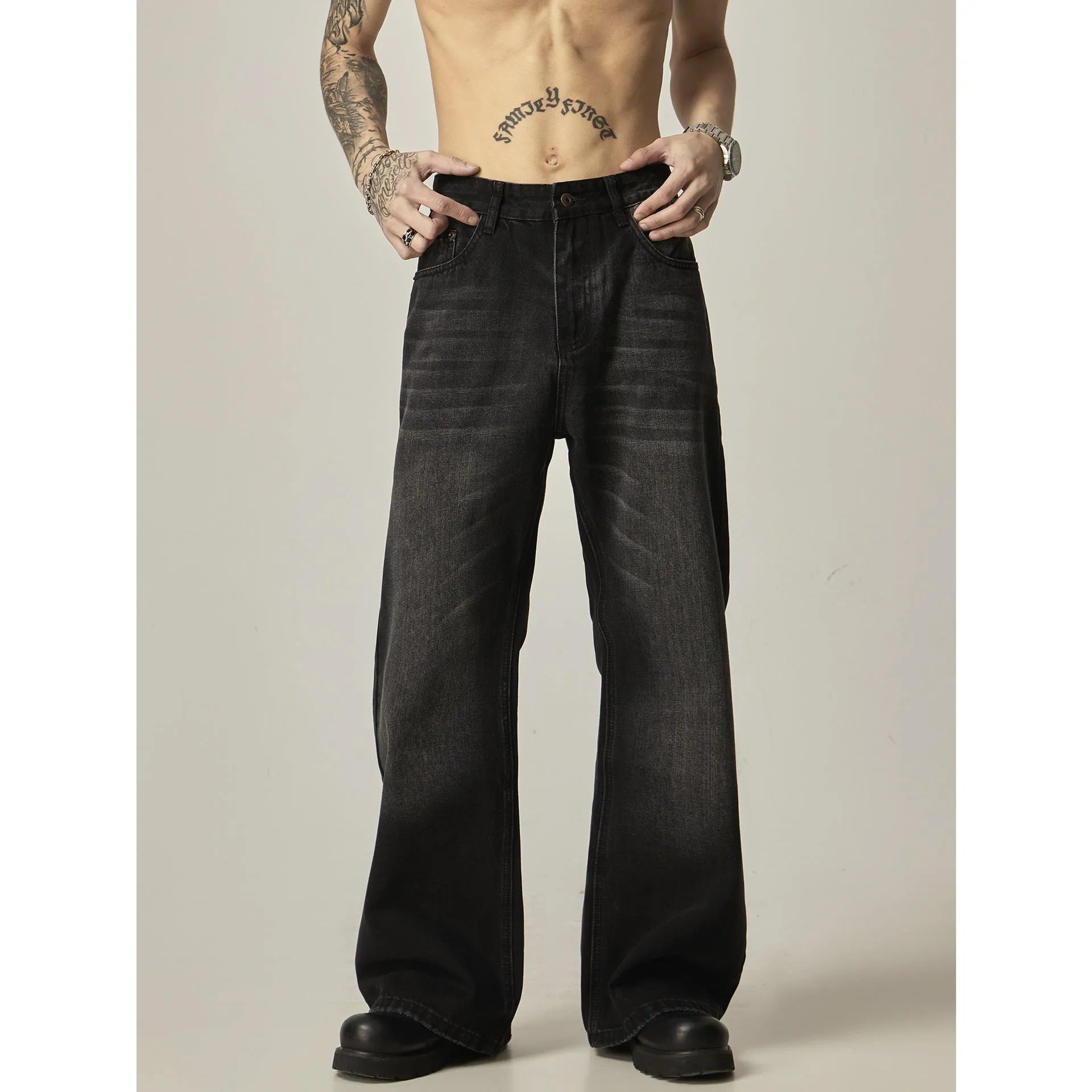 Black loose straight retro jeans with zipper fly on size chart background