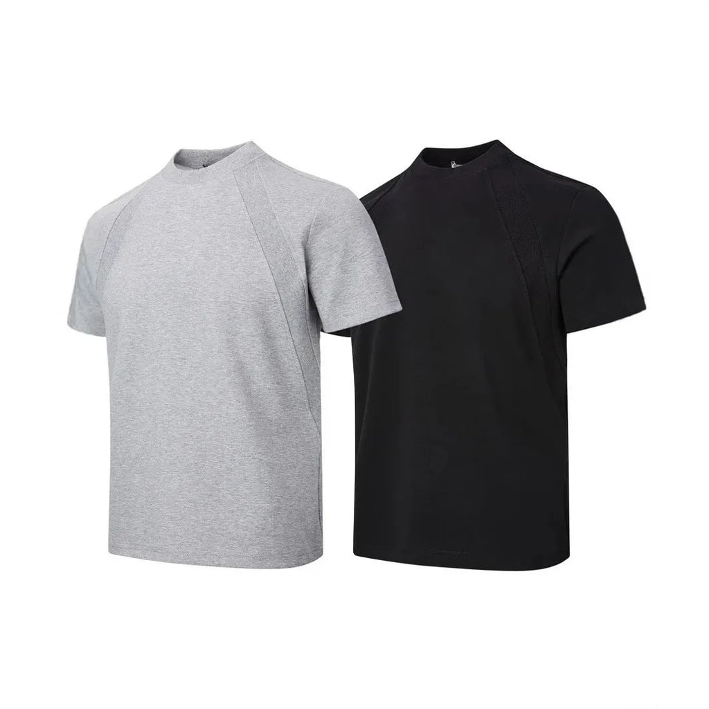Men's loose black short sleeve top with textured air layer stitching on a grey background