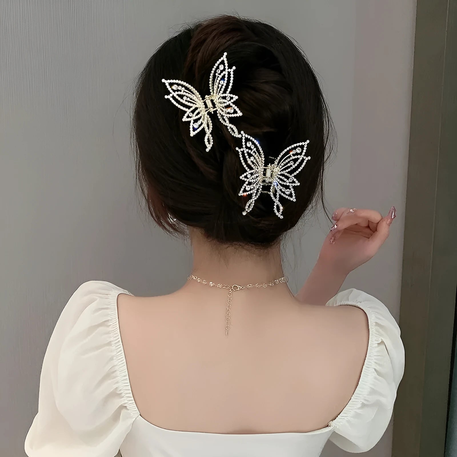 Butterfly-themed alloy hair clip barrette with electroplated finish, either rhinestone or pearl decorative style