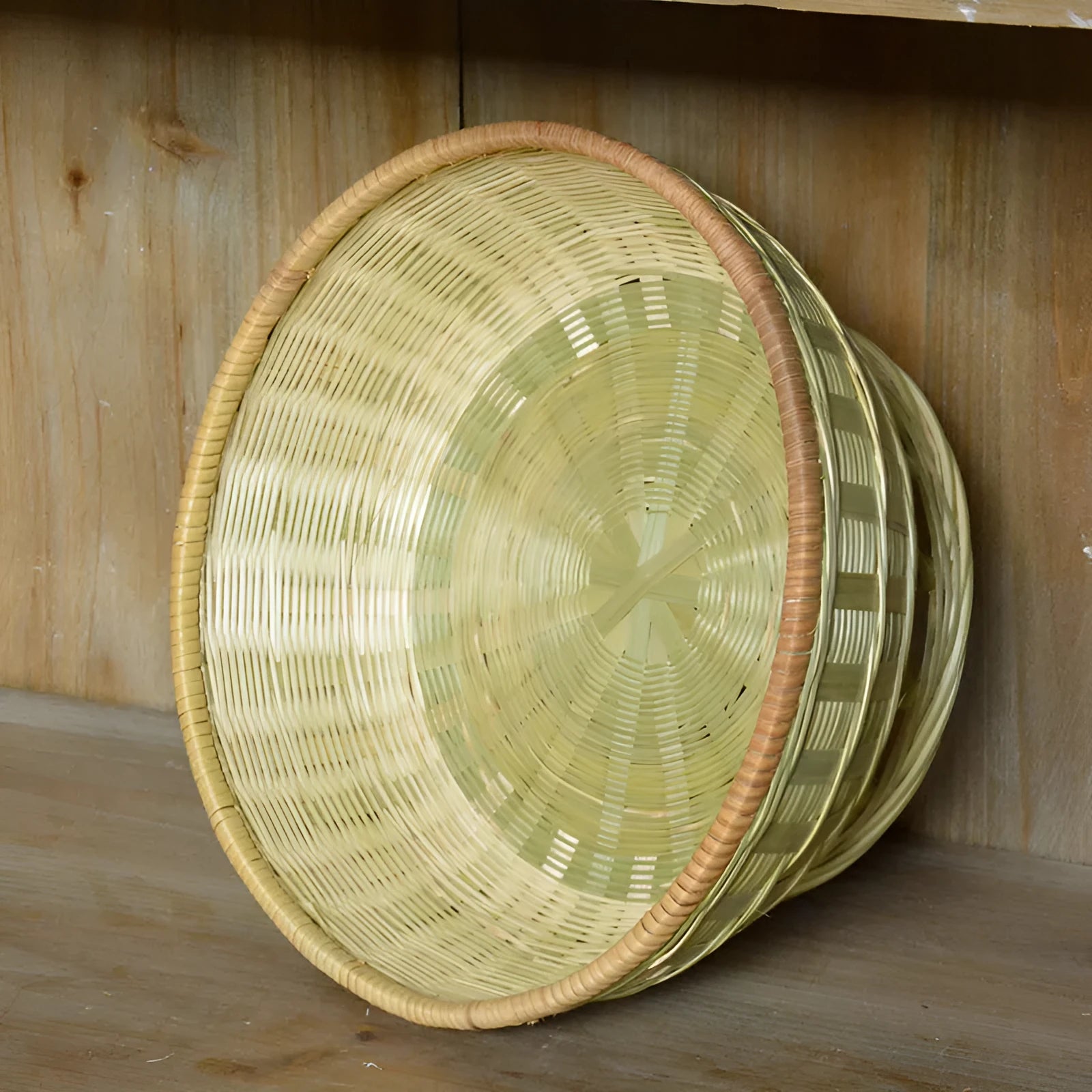 Handmade natural bamboo storage basket in traditional woven construction