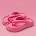 Solid colour thick-soled EVA flip-flops with a bow decoration on the upper.