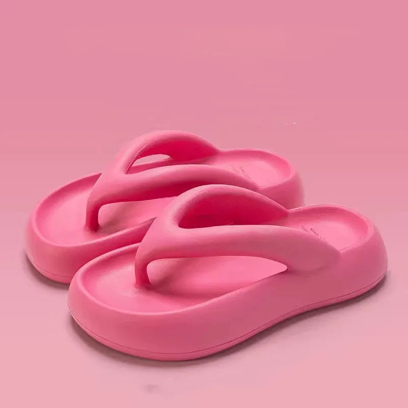 Solid colour thick-soled EVA flip-flops with a bow decoration on the upper.