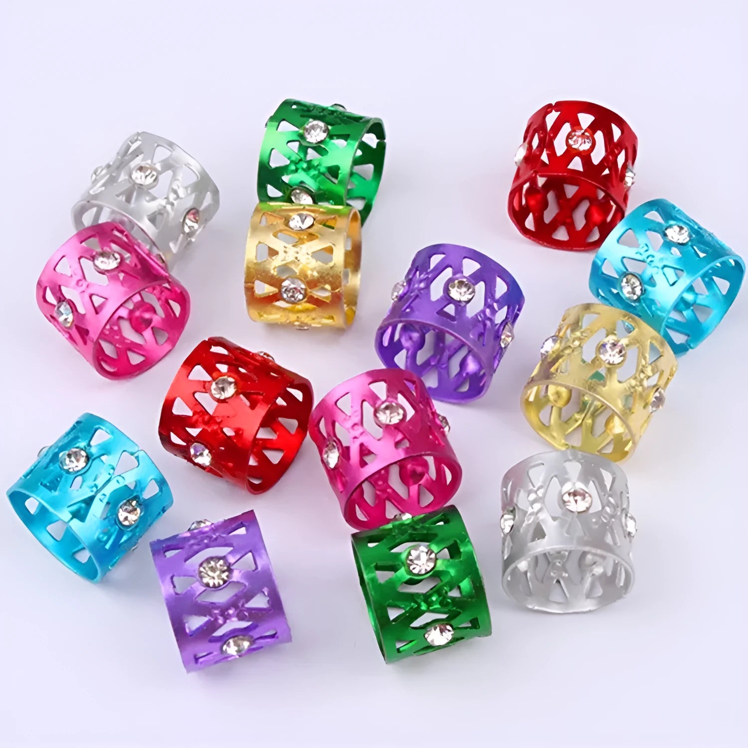 Hollow metal hair ring with jewel decoration shown in one of its eight colour options.