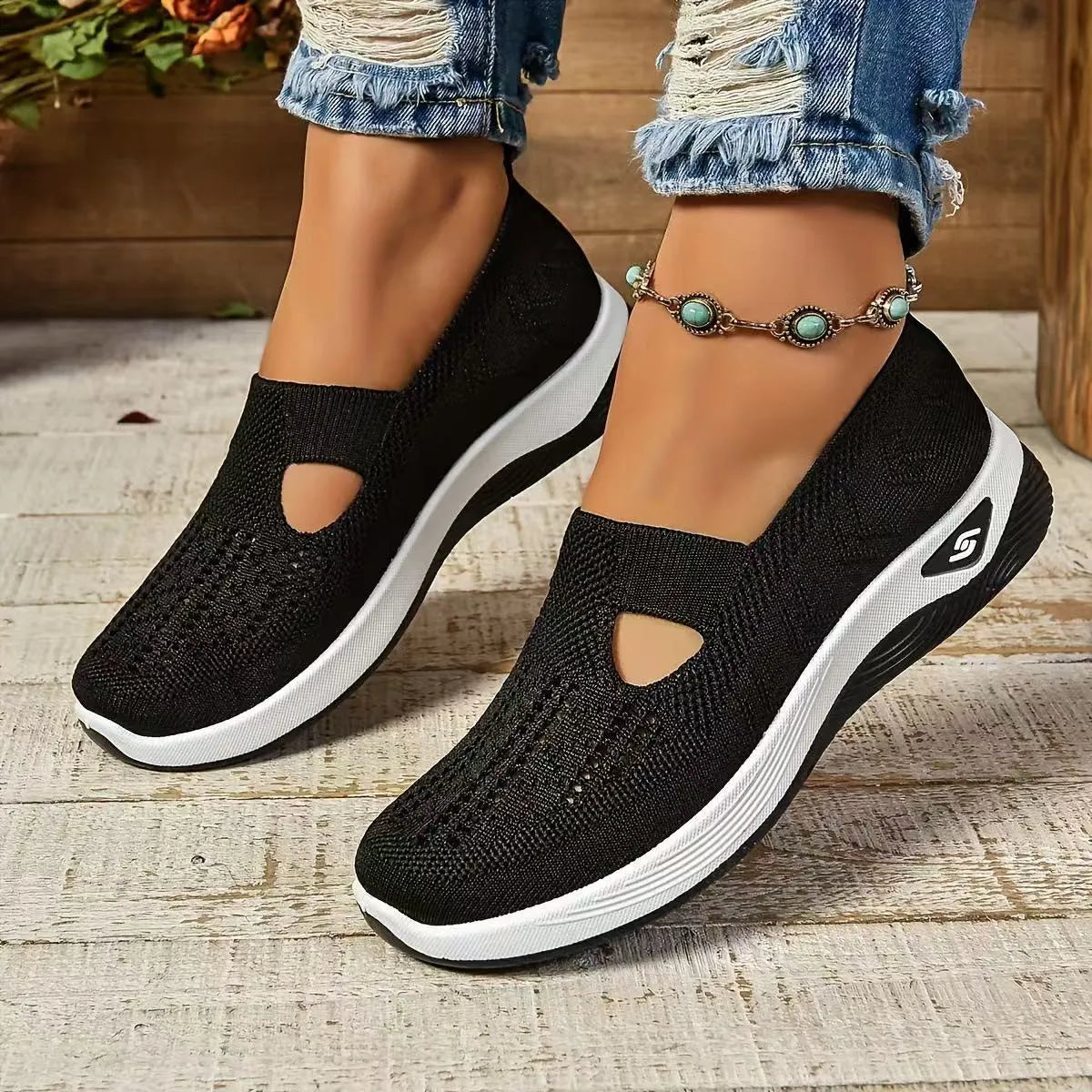Women's light grey mesh casual flats with a T-strap and round toe on a soft PVC sole.
