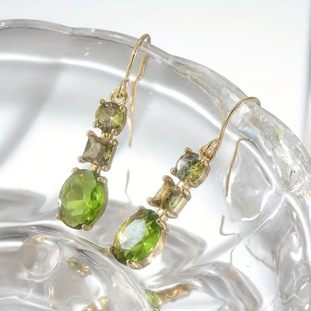 A pair of green copper geometric earrings with a quadrilateral shape and retro bohemian style.