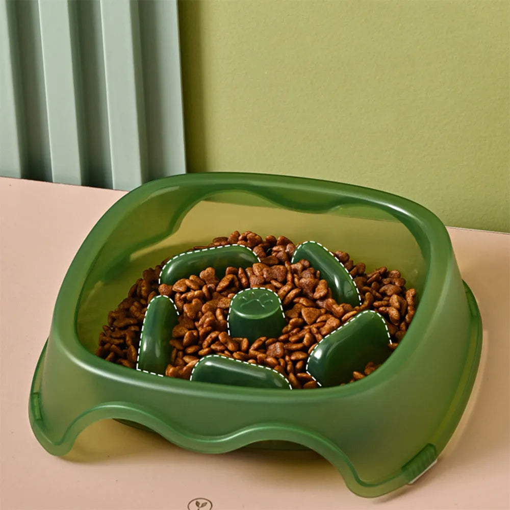 Blue plastic dog slow feeder bowl on a floor, designed to prevent choking by slowing eating pace.